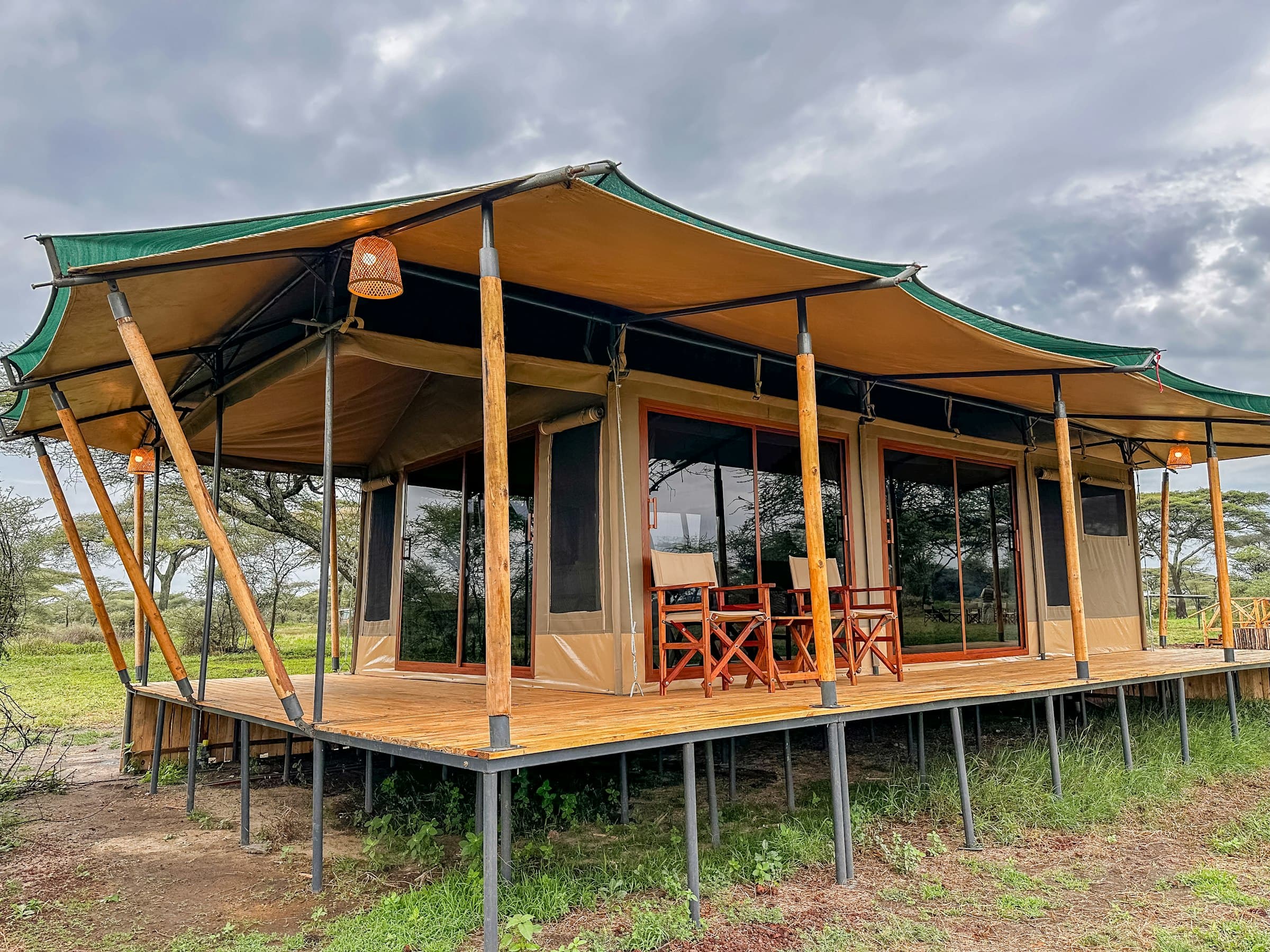An elevated tented suite at twilight